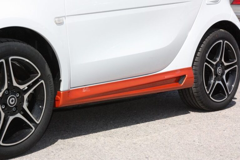 These are the Side Skirts for the Smart Fortwo 453, in Lava Orange Metallic color, brought to you by Smart Power Design. The Fender Flares are also installed.